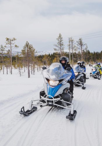 Group,Of,Snowmobiles,On,The,Snow